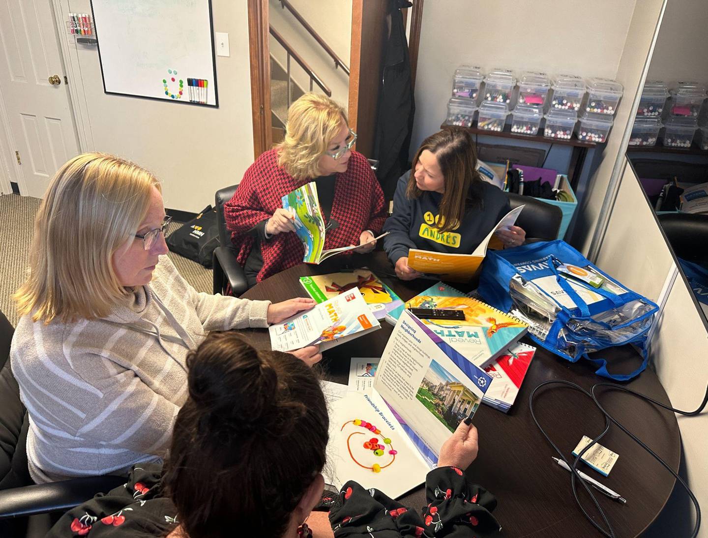 Teachers and administrators meet in one of the small spaces available for collaboration at McHenry School District 15's central office, shared by Supt. Ryan Josh Reitz in a presentation to the school board on Nov. 29, 2022, on why a larger facility is needed.