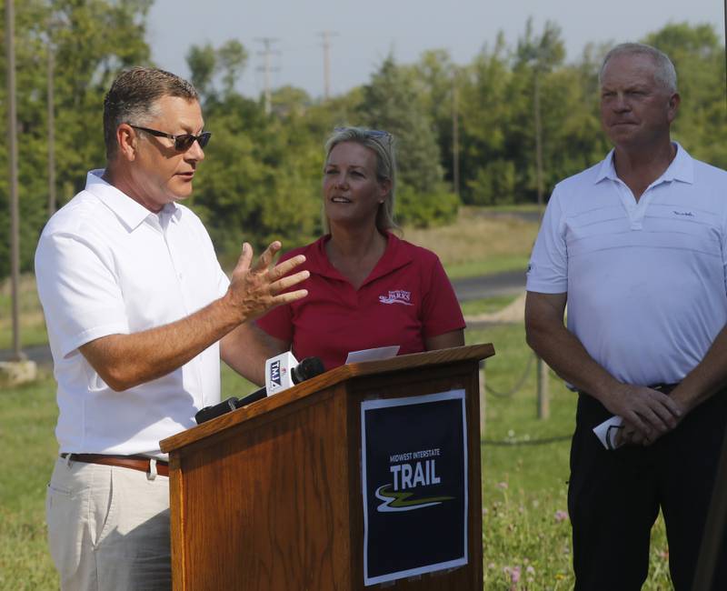 McHenry County Board Chairman Michael Buehler speaks Thursday, Aug. 24, 2023, at Wilmot Mountain Ski Resort, about how the governments of McHenry County and Kenosha County, Wisconsin, along with Thelen Sand & Gravel,  have created a public-private partnership to build the Midwest Interstate Trail, a bike and pedestrian trail to connect the McHenry and Kenosha counties bike and pedestrian trails.