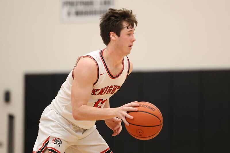 Lincoln-Way Central’s Jack Barrett works the ball against Lemont in the Lincoln-Way West Warrior Showdown on Saturday January 28th, 2023.