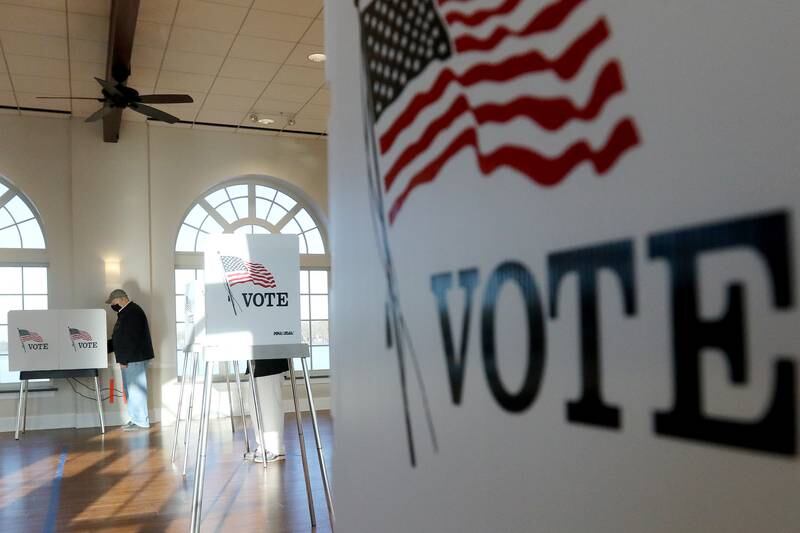 Martin Moister of Lakewood fills out his ballot at Main Beach on Tuesday, Nov. 3, 2020 in Crystal Lake.