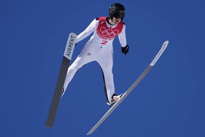 Casey Larson, of the United States, soars through the air during the men's normal hill individual ski jumping trial round at the 2022 Winter Olympics, Saturday, Feb. 5, 2022, in Zhangjiakou, China.