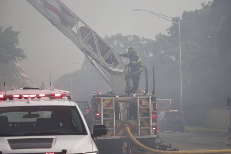 Joliet firefighters at the scene of a fire at an apartment building on Tuesday, June 10, 2025, near Essington Road in Joliet.