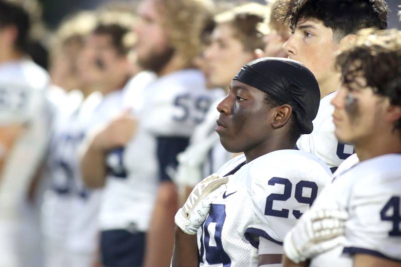 Elias Berthelsen and the Trojans of Cary-Grove line up to face Huntley in varsity football at Huntley High School in Huntley on Friday, Sept. 19, 2025.