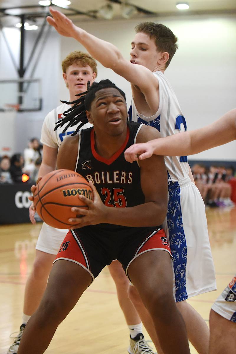 Bradley-Bourbonnais' Jeremiah Jones (25) looks for a way around Mt. Vernon's Ben Pedersen during the IHSA Division 1 Special Olympics Unified Basketball State championship at the University of Illinois Activities and Recreation Center Saturday, March 15, 2025.