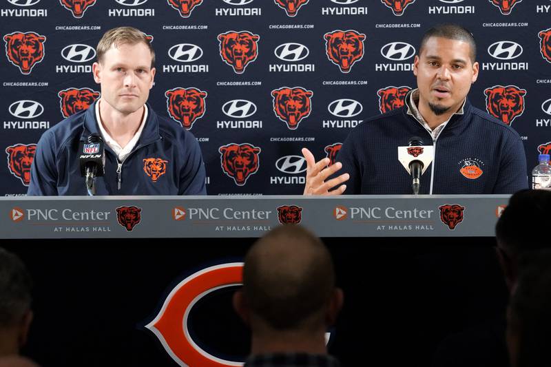 Chicago Bears general manager Ryan Poles, right, talks to media as new head coach Ben Johnson listens to him during a news conference at Halas Hall in Lake Forest, Ill., Wednesday. (AP Photo/Nam Y. Huh)
