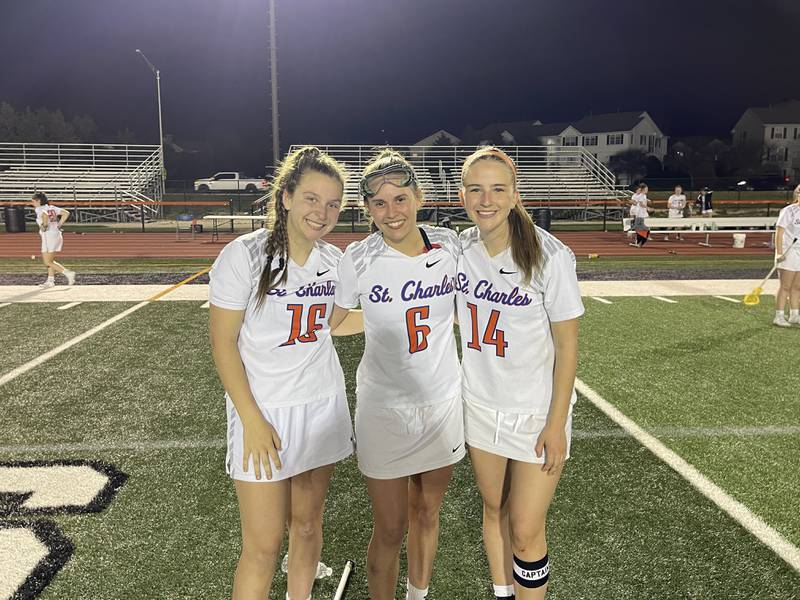 St. Charles girls lacrosse co-op (left to right): Allison Uchill, Katherine Erickson and Caroline Theis. Photo by Jake Bartelson.