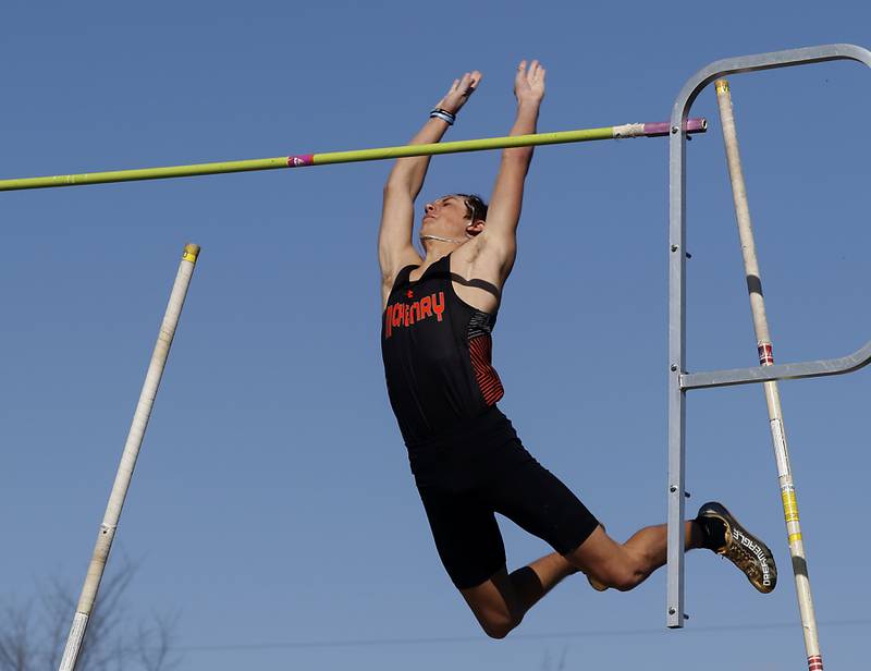 McHenry’s Zachary Galvicius celebrates clearing the ball as he competes in the pole vault Thursday, April 21, 2022, during the McHenry County Track and Field Meet at Richmond-Burton High School.