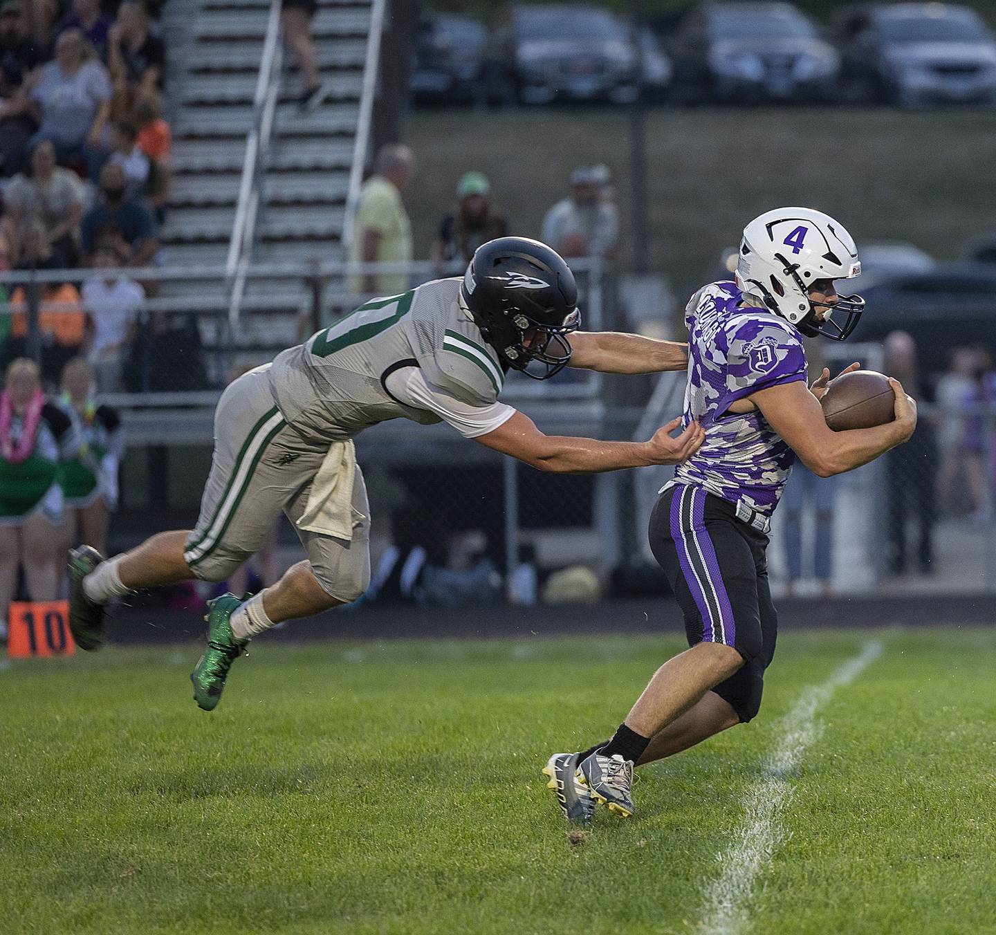 Rock Falls’ Trail Stonitsch misses a tackle on Dixon’s Landon Knigge Friday, Sept. 12, 2025, during Dixon’s home opener.
