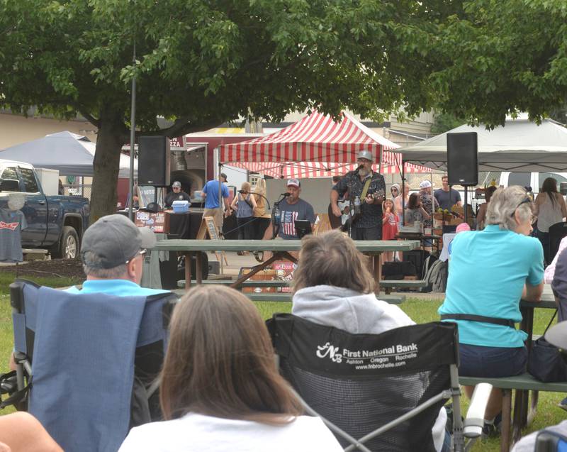 Burn N Bush performed at the River's Edge Farmers Market on Thursday, June 5, 2025. The markets are held each Thursday night from 5-7:30 p.m. at 123 N. 2nd St., along the riverfront below the Oregon dam on the west bank of the Rock River. The weekly events also include music, kids activities, and food booths.
