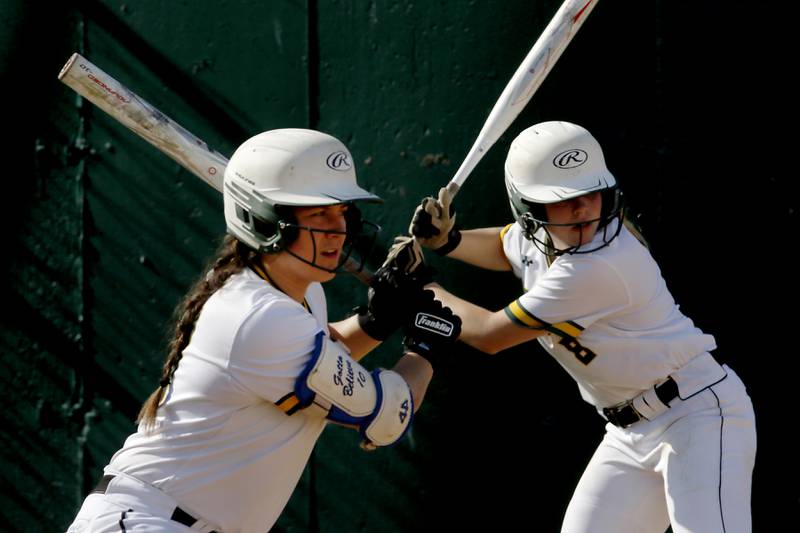 Crystal Lake South's Alexis Pupillo looks at the pitcher as her teammate, Crystal Lake South's Kennedy Grippo watches the pitch from the batting circle during a Fox Valley Conference softball game Monday, May 16, 2022, between Crystal Lake South and Burlington Central at Crystal Lake South High School.