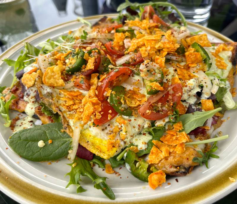 The breakfast pizza at Launch Kitchen is loaded with toppings, including sausage gravy, two different cheeses, pico and a cilantro lime sour cream.