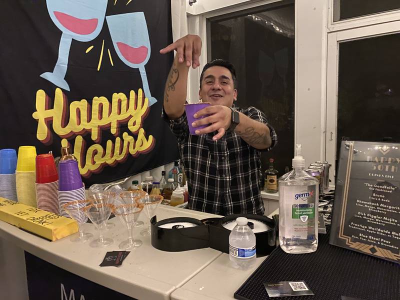 After starting their mobile bartending business in March, Happy Hours co-owners Megan Leuthold and Cesar Rodriguez (pictured here) are hoping to have a busy holiday season; Rodriguez said on Nov. 9, 2022, that they will be hosting up to three parties a day every weekend next month.