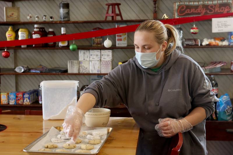 General Store employee Chloe Scott prepares almond crescents for baking on Tuesday, Dec. 15, 2020, inside the store in Greenwood. The building has been a general store since its construction in 1894 and was also the township's post office.