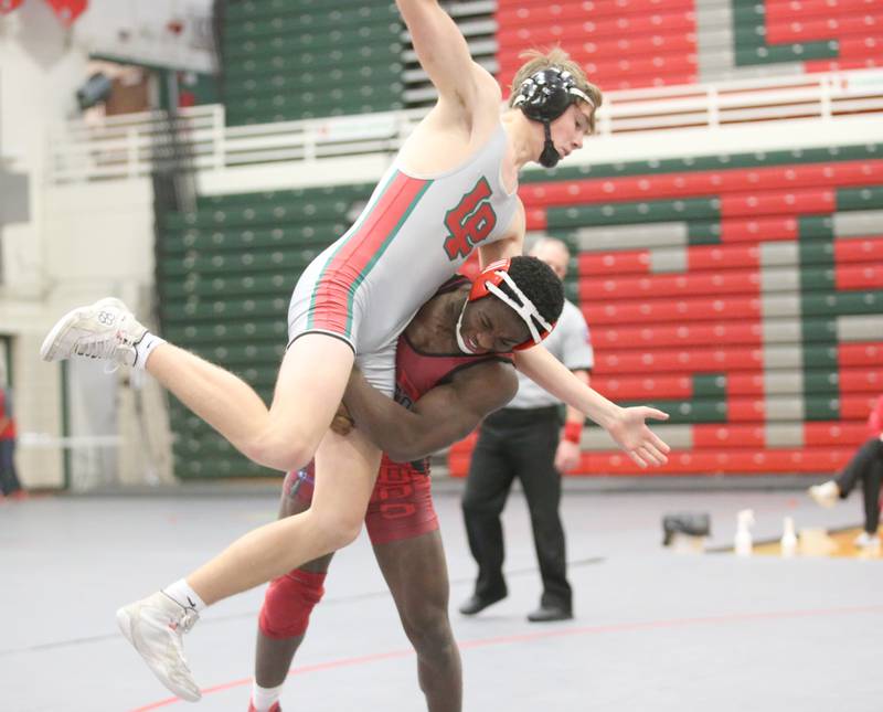L-P's Zach Pocivasek is hoisted by Streator's Jordan Lukes during a meet on Wednesday, Dec. 13, 2023, in Sellett Gymnasium at L-P High School.