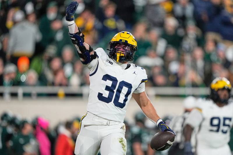 Michigan linebacker Jimmy Rolder reacts after recovering a fumble by Michigan State wide receiver Chrishon McCray during the first half of an NCAA college football game Saturday, Oct. 25, 2025, in East Lansing, Mich. (AP Photo/Ryan Sun)
