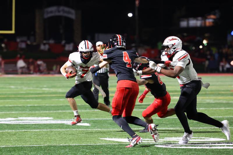 Bradley-Bourbonnais' Isaac Allison tries to evade Lincoln-Way Central defenders during the Knight's 28-20 victory over Bradley-Bourbonnais on Friday, Oct. 3, 2025.