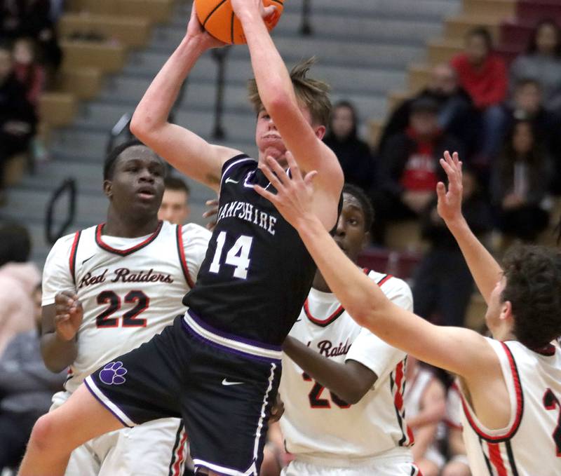 Hampshire’s Tyler Lacke works under the hoop in varsity boys basketball on Friday, Dec. 19, 2025, at Huntley High School in Huntley.