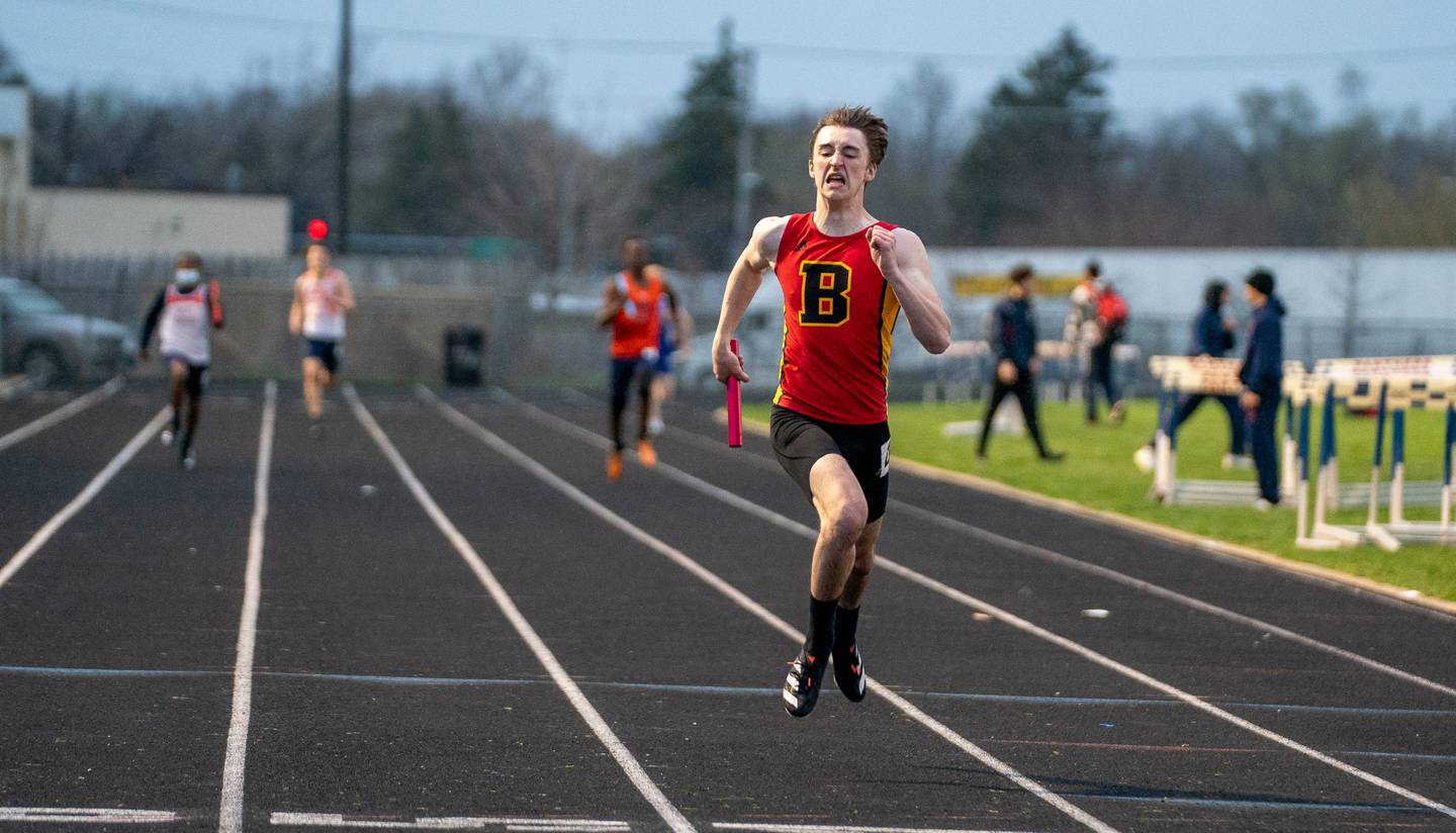Batavia’s Weston White helps his team finish first in the 4x200 meter relay during the Roger Wilcox Track and Field Invitational at Oswego High School on Friday, April 29, 2022.
