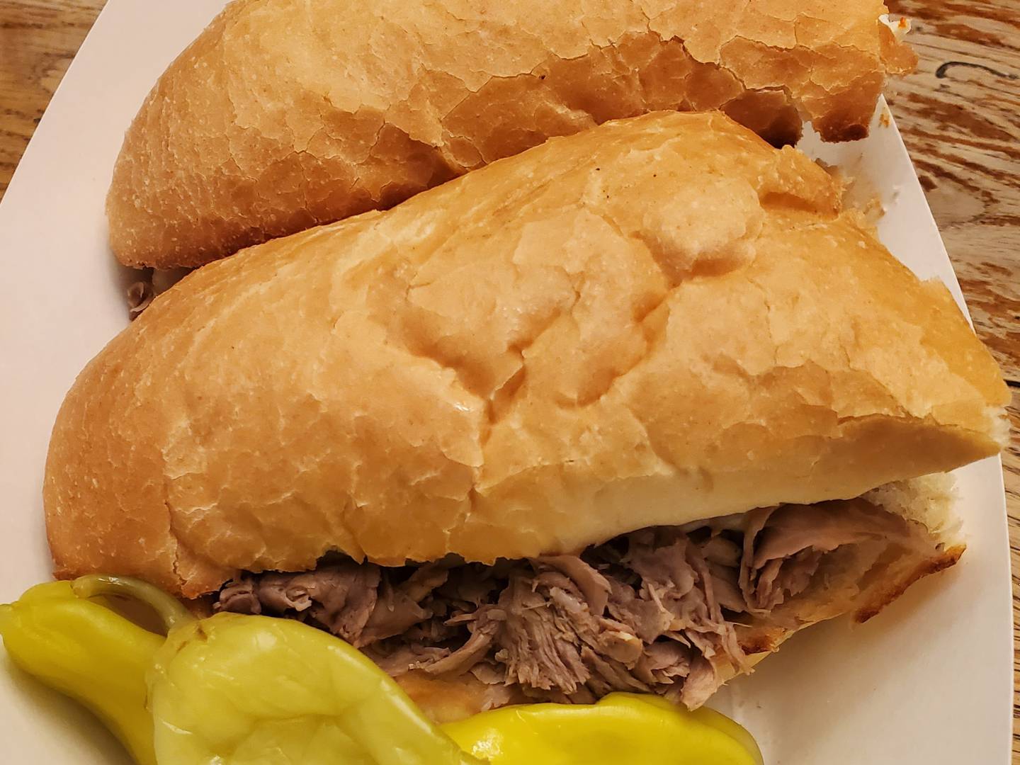 To top it off, we also ordered an Italian Beef Sandwich ($8.00).  The sandwich was great and came with a side of peppers to go with it.  It was flavorful and had just the right amount of meat to fill his bun without becoming a mess on the plate.