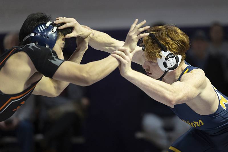 Sterling’s Cameron Minor (right) faces off against  Freeport’s Steven Van Tuesday, Jan. 13, 2025, in a triangular meet at Dixon High School.