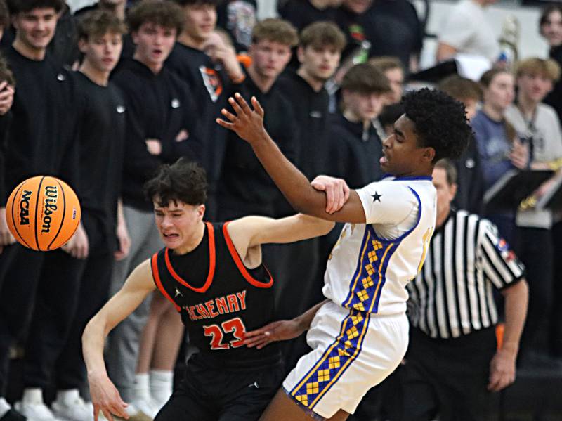 Warren’s Braylon Walker, right, guards McHenry’s Marko Stojich in IHSA Class 4A Regional Title Game boys basketball action on Friday, Feb. 28, 2025 at McHenry High School in McHenry.