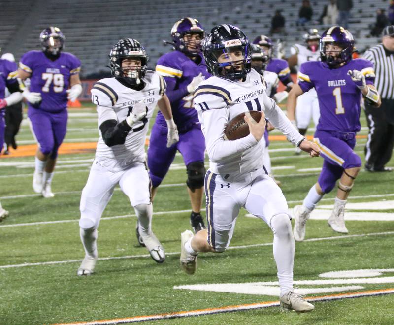 IC Catholic's quarterback Dennis Mandala sprints down the field to score a touchdown in the Class 3A State title game on Friday, Nov. 25, 2022 at Memorial Stadium in Champaign.