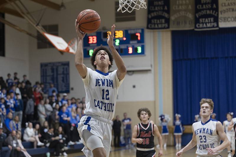 Newman’s Isaiah Williams puts in a lay-up against Hall Friday, Feb. 2, 2024 at Newman High School.
