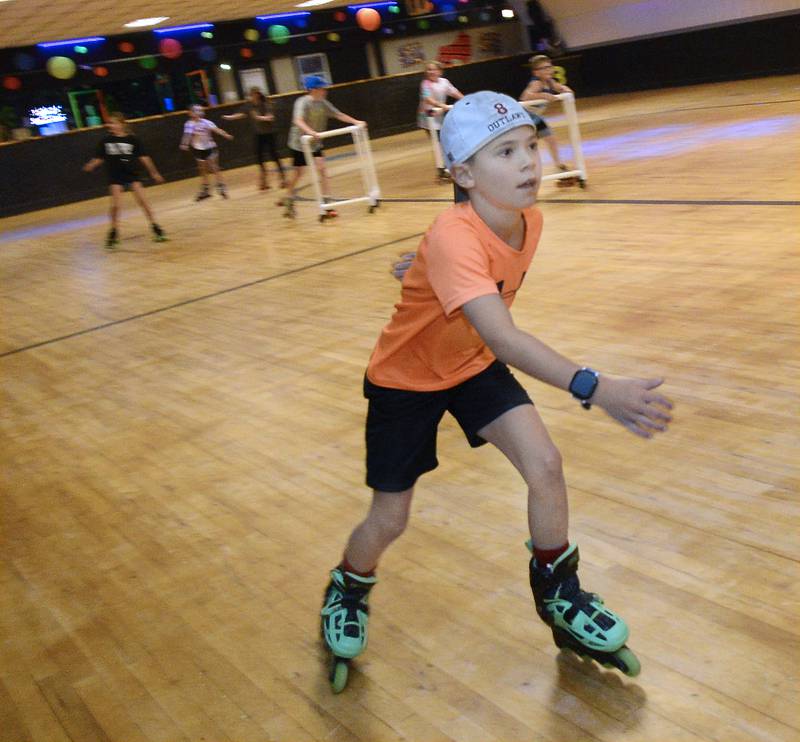 Hunter Jaegle leads the pack as he skates around the rink Wednesday, June 28, 2023, at the Paramount in Ottawa during the Ottawa Recreation All Parks Skating Party.