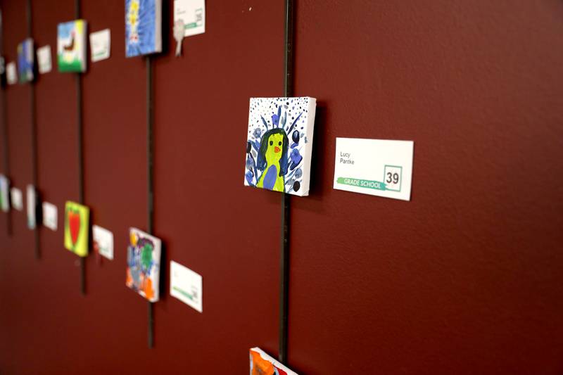 Art work done on small canvasses by early childhood students through adults is on display at the Westmont Public Library.