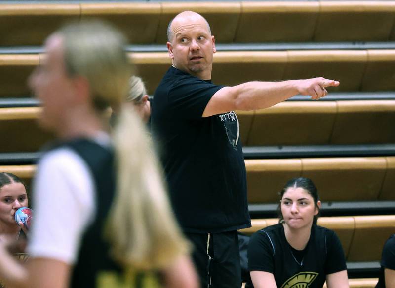 Sycamore head coach Adam Wickness instructs his team Thursday, June 12, 2025, in the Geneva High School Varsity Summer League.