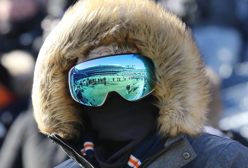 Fans do their best to stay warm as the Bears hosted the Bills Sunday, Dec. 24, 2022, at Soldier Field in Chicago.