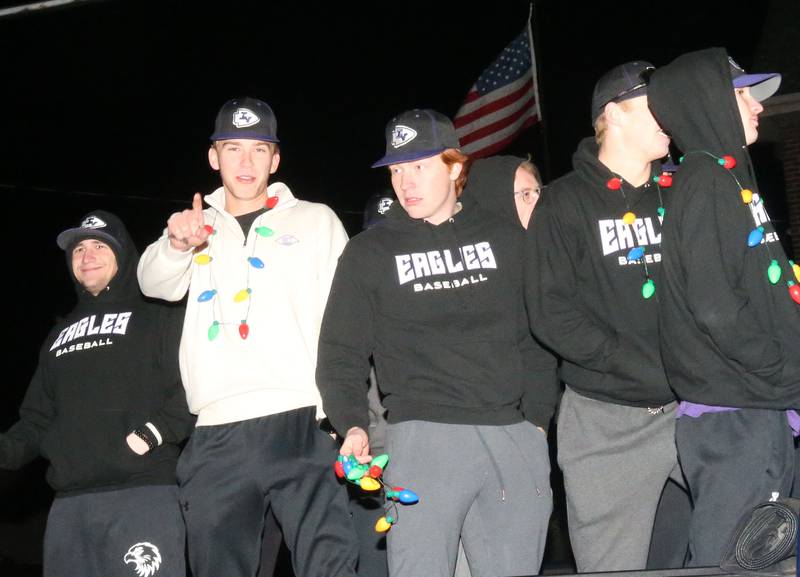 Members of the Illinois Valley Community College baseball team ride a float during the annual Christmas Parade on Saturday, Dec. 7, 2024 on Peoria Street in Peru.