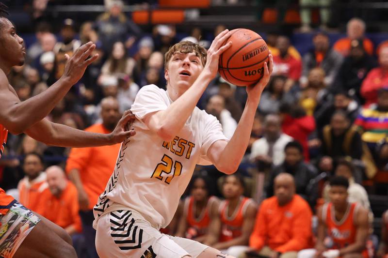 Joliet West’s Drew King works in the paint against Romeoville on Tuesday January 31st, 2023.