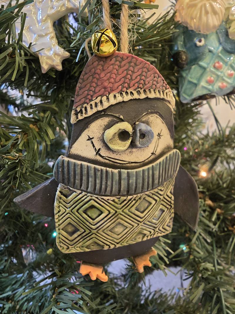 Janell Mayer has handcrafted ornaments and some holiday "uggles" for sale at the Artisans on Main in Woodstock.