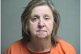Hebron woman accused of shooting a firearm inside her home, hitting a TV and a wall