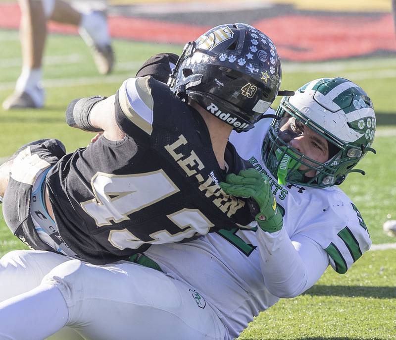 Brown County's Vladimir Rebarcak hauls down Alec Schlichting for a loss Friday, Nov. 28, 2025, in the Class 1A football finals at Hancock Stadium at ISU.