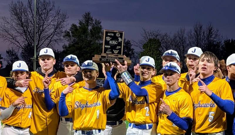 Johnsburg's Tayden Pinkowski (1) and Riley Johnson (2) hold aloft the Kishwaukee River Conference championship trophy after the Skyhawks beat Harvard 14-0 in five innings Wednesday, May 7, 2025, at Johnsburg.