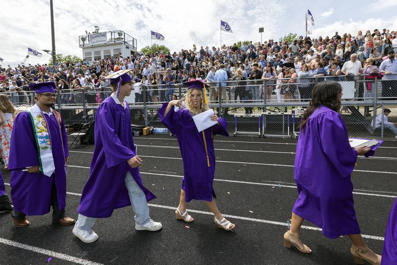 Graduate Emma Olson leaves the field with the rest of the Class of 2025 Sunday, May 25, 2025, during Dixon High School’s graduation.