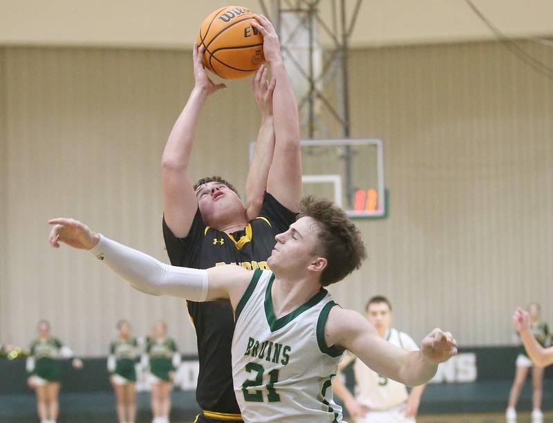 Ashton-Franklin Center's Nolan Rueff grabs a rebound over St. Bede's Gus Burr during the Class 1A Regional quarterfinal game on Monday, Feb. 24, 2025 at St. Bede Academy.