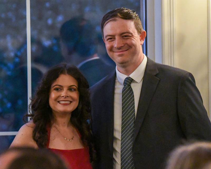 Derek Conley, St. Charles' economic development director, poses for a photo with St. Charles Area Chamber of Commerce board member Ashley Zeman after she presented him with a Civic Image Award on Friday May 1, 2026, during the St. Charles area chamber of commerce Charlemagne awards dinner held at The Royal Fox Country Club in St. Charles.