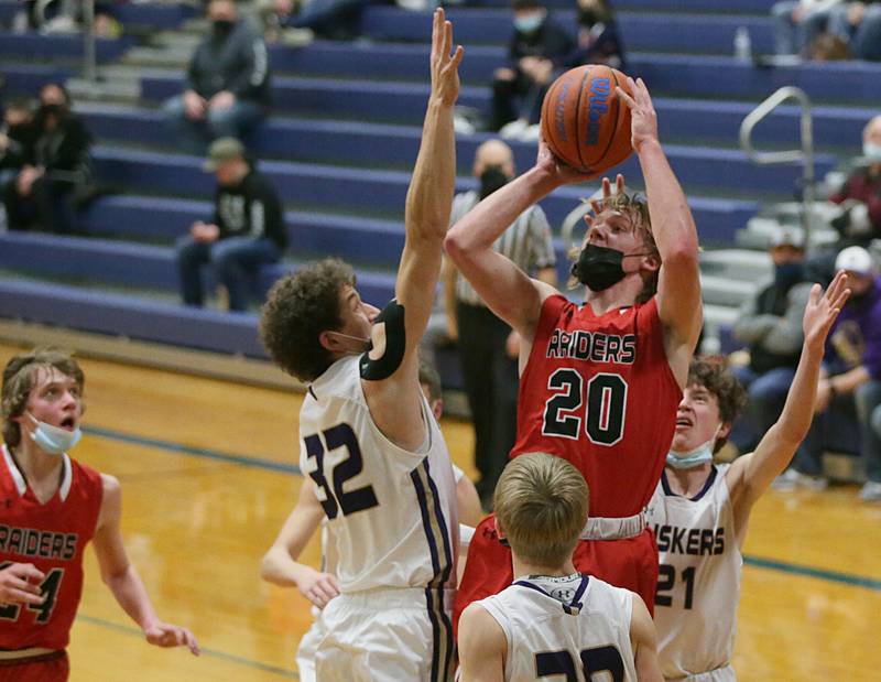 Earlville's Griffin Cook, (20) shoots a shot over Serena's Ben Shugrue, (32) in the Little 10 Conference Tournament on Monday Jan. 31, 2022 in Somonauk.