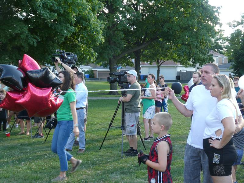 A prayer vigil and balloon release was held at Oriole Park in Chicago on Monday night, August 1, 2022 to mourn the loss of seven killed, including Lauren Dobosz and her four children, in a tragic car crash that occurred Sunday on I-90 near Hampshire.