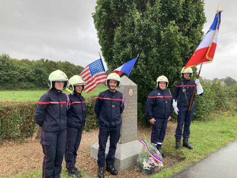 On August 12, 2023, members of the Villaines-la-Juhel fire service in France gather around the memorial dedicated to Dixon man, Cpl. Ronald Baker, who was killed by German soldiers during World War II.
