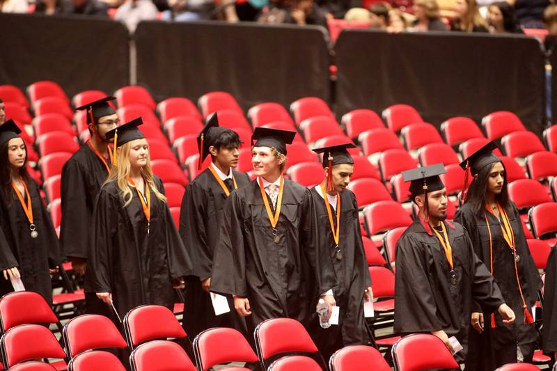 St. Charles East graduates enter the Northern Illinois University Convocation Center in DeKalb for the school’s  commencement ceremony at  on Monday, May 23, 2022.