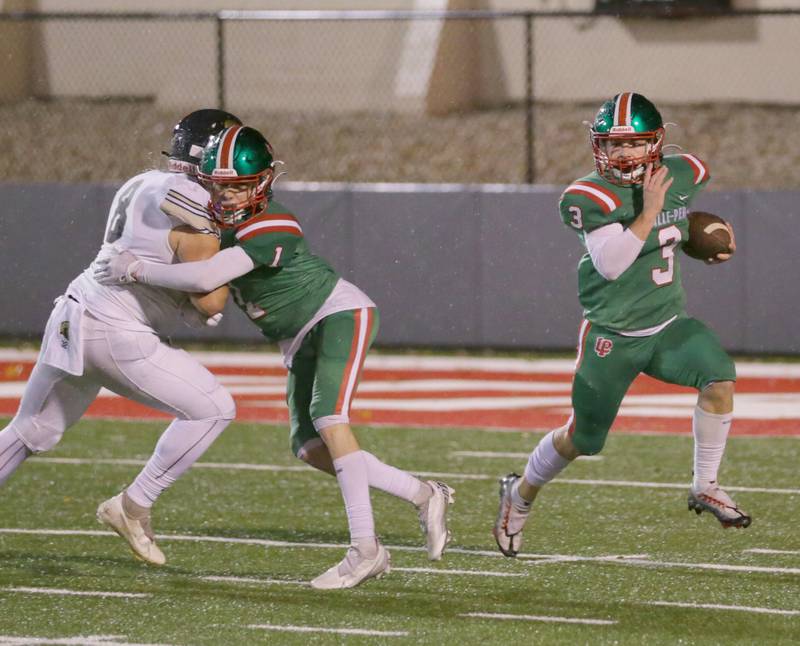 L-P's Mason Lynch (3) runs the ball down the field as teammate Caleb Burrell (1) blocks Sycamore's Diego Garcia (8) on Friday, Oct. 14, 2022 at Howard Fellows Stadium in Peru.