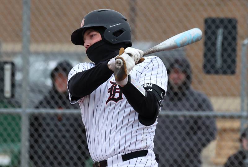 DeKalb's Brodie Farrell takes a cut during their game against Harlem Tuesday, April 1, 2025, at DeKalb High School.