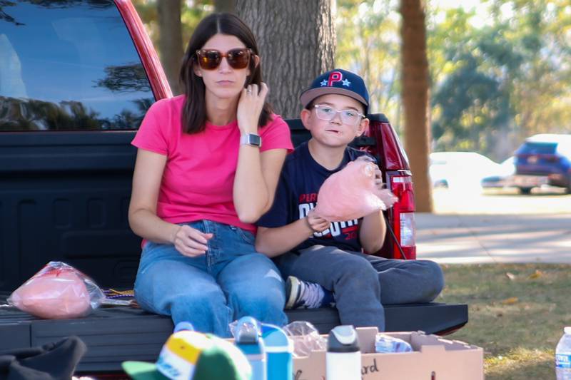 Visitors eat cotton candy at the annual Harvest Fest on Saturday, Oct. 19, 2024, at Kirby Park in Spring Valley.