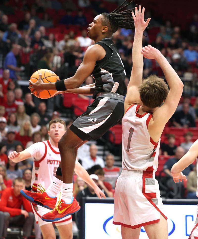 Kaneland's Marshawn Cocroft goes by Morton's Jude Zeller Monday, March 9, 2026, during their IHSA Class 3A supersectional matchup in the Convocation Center at Northern Illinois University in DeKalb.