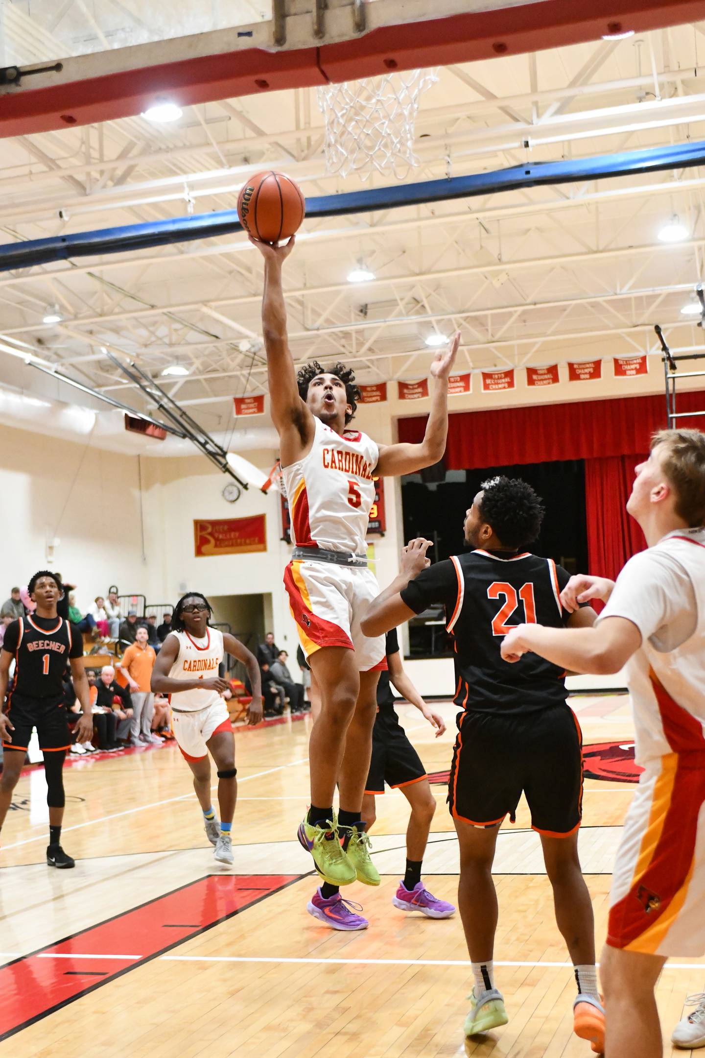 St. Anne's Deion Fifer hits a jumpshot in the paint on Friday, Feb. 14, 2025, during the Cardinals' 70-38 victory over Beecher in the River Valley Conference championship.
