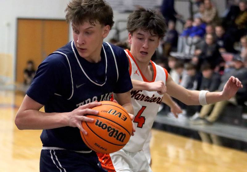McHenry’s Cole Tapia, right, guards Cary-Grove’s Evan Bauer in varsity boys basketball on Tuesday, Feb. 17, 2026, at McHenry High School in McHenry.